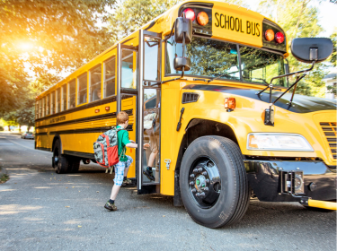  School bus with student entering